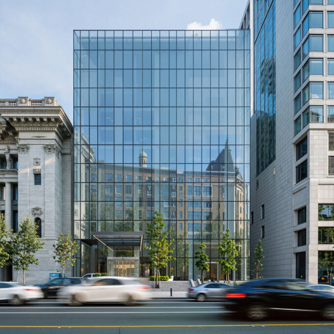 Photorealistic AI visualization of a contemporary glass office building integrated with historic urban architecture and streetscape.